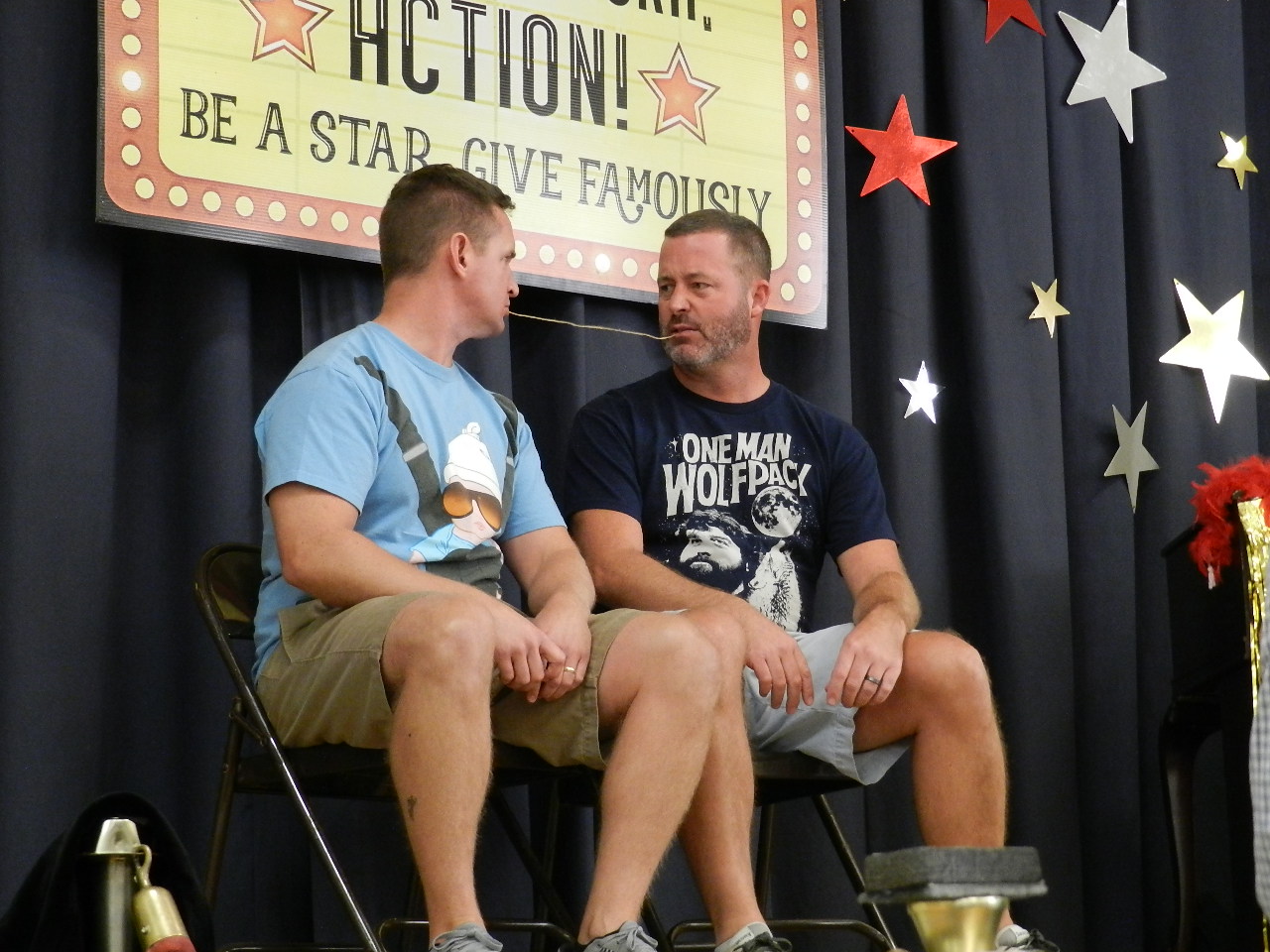 Russ Guffey and Chris Gilkey acting out movie scenes for the 2016 Mid-Campaign Luncheon